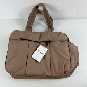 CALPAK Luka Duffel Chocolate Brown Top Handles, Crossbody Strap, Luggage Sleeve